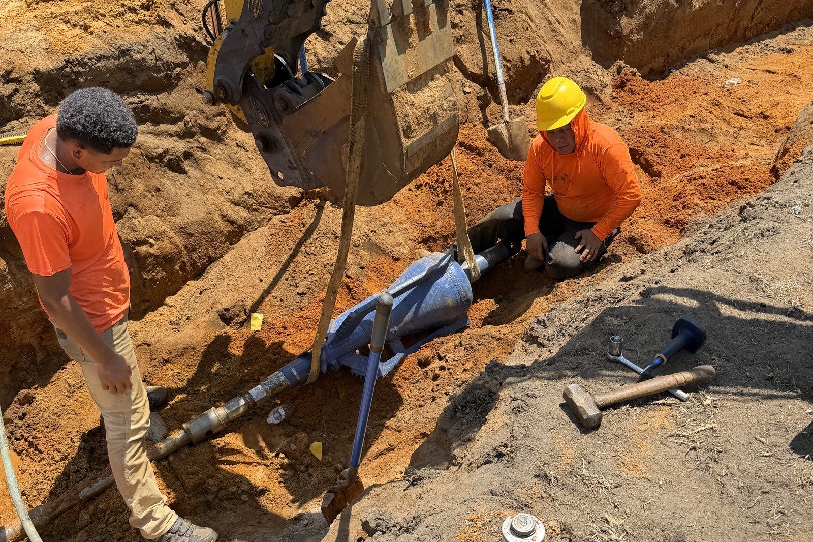 Crew making a connection down in the pit