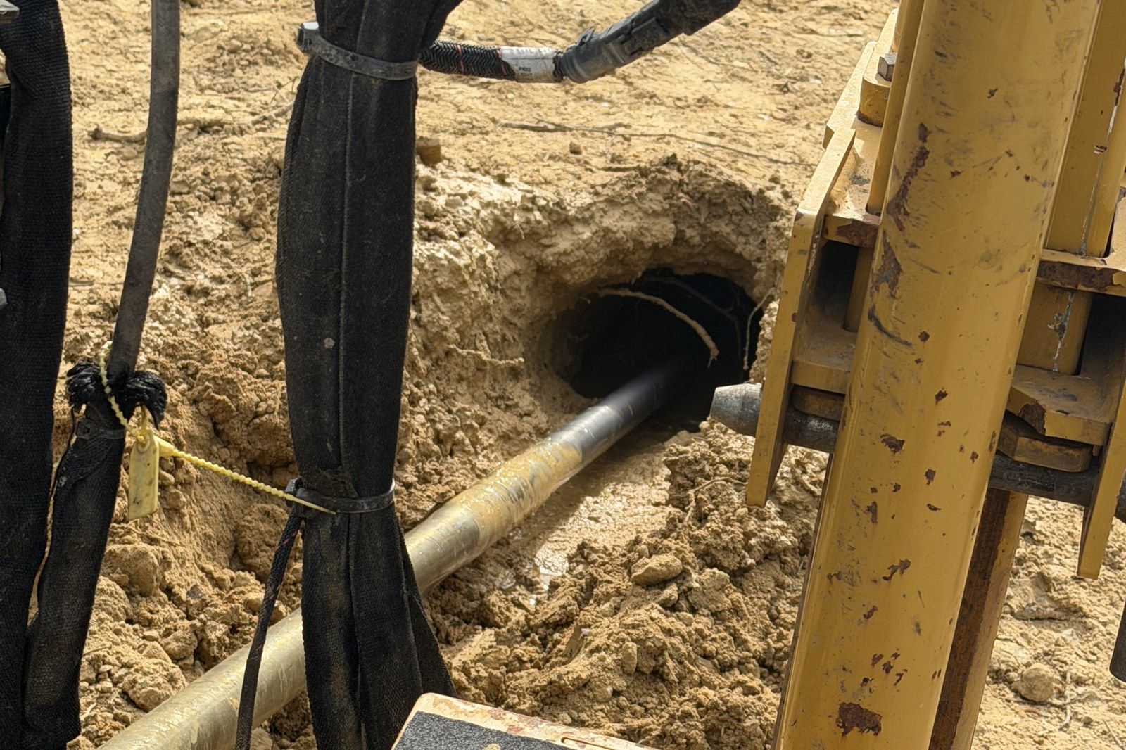Conduit pulled into the bore at the entry pit